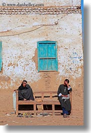 africa, al kab, benches, clothes, egypt, keffiyeh, men, scarves, vertical, villages, windows, womens, photograph