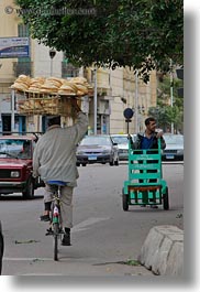 africa, arabic, bicycles, bread, cairo, egypt, heads, men, old town, style, vertical, photograph