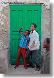 africa, boys, doors, egypt, green, laughing, nubian village, vertical, photograph