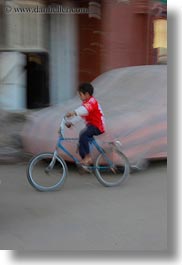 africa, bicycles, blur, childrens, egypt, motion, people, vertical, photograph