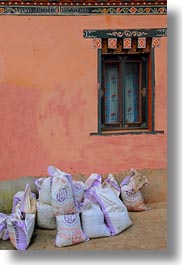 asia, bags, bhutan, cement, lobeysa village, vertical, photograph