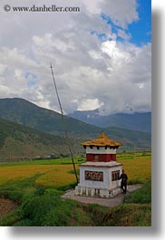 asia, bhutan, buddhist, clouds, lobeysa village, men, nature, prayers, religious, sky, turning, vertical, wheels, photograph
