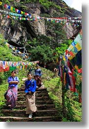 asia, asian, bhutan, buddhist, flags, green, hikers, hiking, lush, people, prayer flags, religious, stairs, structures, vertical, photograph