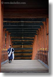 asia, asian, bhutan, bridge, buddhist, men, over, people, punakha dzong, religious, temples, vertical, walking, photograph