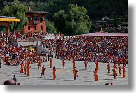 asia, asian, bhutan, buddhist, dancers, horizontal, oranges, people, religious, style, tashichho dzong, photograph