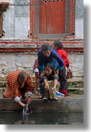 asia, asian, bhutan, childrens, drinking, girls, people, vertical, wangduephodrang dzong, water, photograph