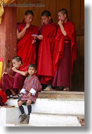 asia, asian, bhutan, boys, buddhist, clothes, colors, monks, people, red, religious, robes, style, vertical, wangduephodrang dzong, photograph