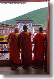 asia, asian, balconies, bhutan, buddhist, clothes, colors, monks, people, religious, robes, saffron, style, vertical, wangduephodrang dzong, photograph