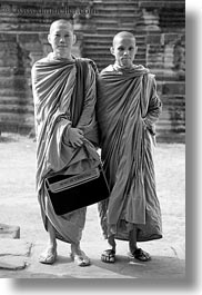 angkor wat, asia, black and white, browns, cambodia, monks, people, robes, two, vertical, photograph