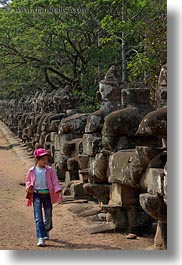 asia, cambodia, gates, girls, pink, south gate, statues, vertical, walking, photograph
