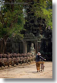 asia, bicycles, cambodia, gates, pushing, vertical, victory gate, womens, photograph