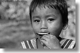 asia, black and white, boys, cambodia, eating, horizontal, leaves, people, photograph