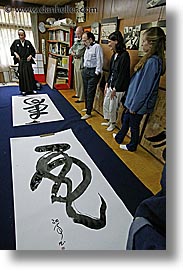 asia, calligraphers, calligraphy, groups, japan, people, vertical, viewing, photograph