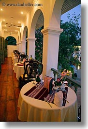 archways, asia, buildings, dining, hotels, laos, luang prabang, structures, tables, vertical, photograph