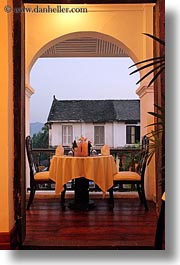 archways, asia, buildings, dining, doorways, hotels, laos, luang prabang, structures, tables, vertical, photograph