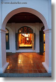 archways, asia, buildings, glow, hotels, laos, lights, luang prabang, open, structures, vertical, windows, photograph