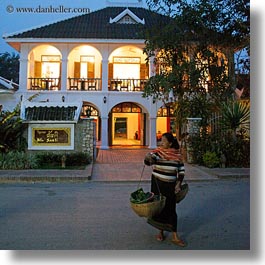 asia, buildings, carrying, don ganh, dusk, glow, hotels, laos, lights, luang prabang, square format, structures, womens, photograph