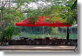 asia, horizontal, laos, luang prabang, red, trees, umbrellas, photograph