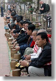asia, asian, baskets, laos, luang prabang, men, offerings, people, rice, vertical, photograph