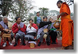 alms, asia, asian, colors, giving, giving alms, horizontal, laos, luang prabang, men, monks, oranges, people, procession, photograph