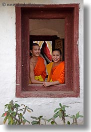 asia, asian, colors, laos, luang prabang, men, monks, oranges, people, two, vertical, windows, photograph