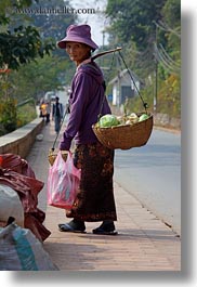 asia, carrying, clothes, don ganh, hats, laos, luang prabang, people, vertical, womens, photograph