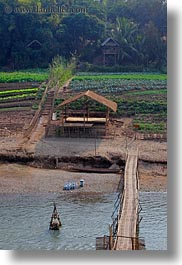 agriculture, asia, bamboo, bridge, buildings, huts, laos, luang prabang, materials, nature, rivers, roofs, scenics, structures, thatched, vertical, water, photograph