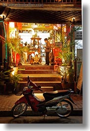 asia, bicycles, bikes, fronts, laos, luang prabang, nite, stores, transportation, vertical, photograph