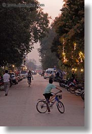 asia, bicycles, bikes, boys, laos, luang prabang, streets, transportation, vertical, photograph