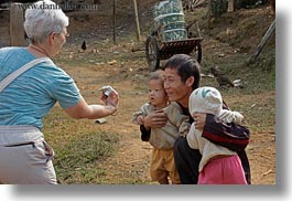 asia, asian, cameras, childrens, emotions, fathers, hmong, horizontal, laos, people, smiles, tourists, viewing, villages, photograph