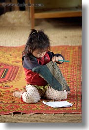 asia, buildings, classroom, girls, hmong, laos, paper, pencil, rugs, school, structures, vertical, villages, photograph