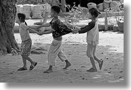 asia, asian, black and white, childrens, horizontal, laos, people, pulling, river village, shirts, villages, photograph