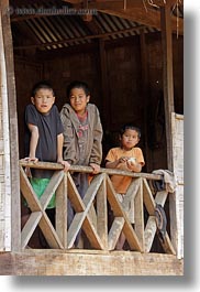 asia, asian, balconies, boys, emotions, laos, people, river village, smiles, vertical, villages, photograph