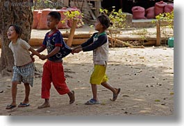 asia, asian, childrens, emotions, groups, horizontal, laos, people, pulling, river village, shirts, smiles, villages, photograph