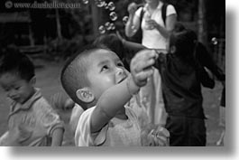 asia, asian, black and white, bubbles, childrens, emotions, horizontal, laos, people, playing, poverty, river village, smiles, villages, photograph