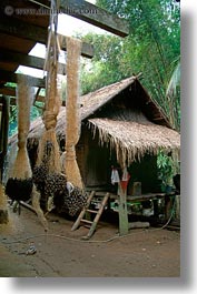 asia, huts, laos, poverty, river village, roofs, thatched, vertical, villages, photograph