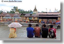 asia, horizontal, kathmandu, men, nepal, pashupatinath, rivers, umbrellas, womens, photograph