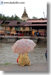 asia, kathmandu, nepal, pashupatinath, rivers, umbrellas, vertical, womens, photograph