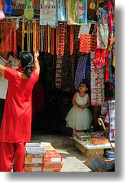 asia, girls, kathmandu, little, nepal, patan darbur square, shops, vertical, womens, photograph