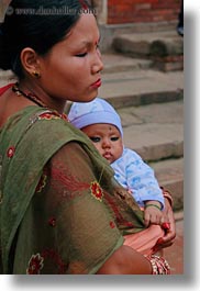asia, babies, bindi, childrens, girls, hindu, jewelry, kathmandu, mothers, nepal, patan darbur square, people, religious, sindoor, tikka, vertical, womens, photograph