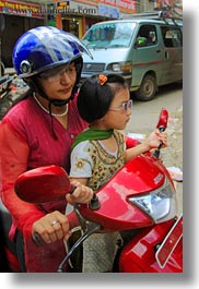 asia, childrens, daughter, girls, kathmandu, moped, mothers, nepal, patan darbur square, people, vertical, womens, photograph