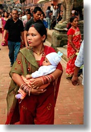 asia, babies, bindi, earrings, hindu, jewelry, kathmandu, mothers, nepal, patan darbur square, religious, sindoor, tikka, vertical, womens, photograph