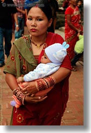asia, babies, bindi, earrings, hindu, jewelry, kathmandu, mothers, nepal, patan darbur square, religious, sindoor, tikka, vertical, womens, photograph