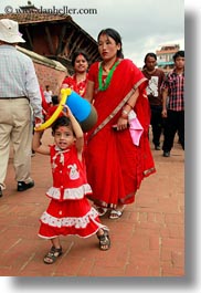 asia, daughter, emotions, hindu, kathmandu, mothers, nepal, patan darbur square, religious, sindoor, smiles, tikka, vertical, womens, photograph