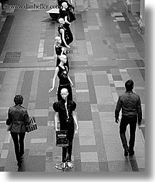 asia, black and white, buildings, mannequins, moscow, pedestrians, russia, rym shopping mall, vertical, photograph