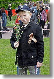 asia, baseball cap, boys, childrens, clothes, flowers, hats, moscow, nature, people, posing, russia, tulips, vertical, photograph