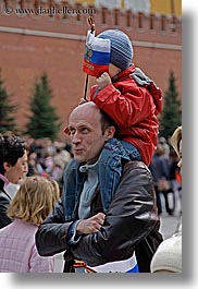 asia, clothes, emotions, fathers, flags, hats, humor, men, moscow, people, russia, shoulders, sons, vertical, photograph