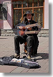 artists, asia, beards, clothes, double, emotions, guitars, hats, instruments, men, moscow, music, musicians, neck, people, playing, russia, serious, vertical, photograph