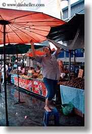 asia, bangkok, fixing, people, thailand, umbrellas, vertical, womens, photograph