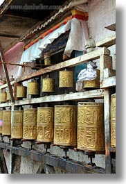 asia, buddhist, golden, lhasa, prayers, religious, spinning, temples, tibet, vertical, photograph